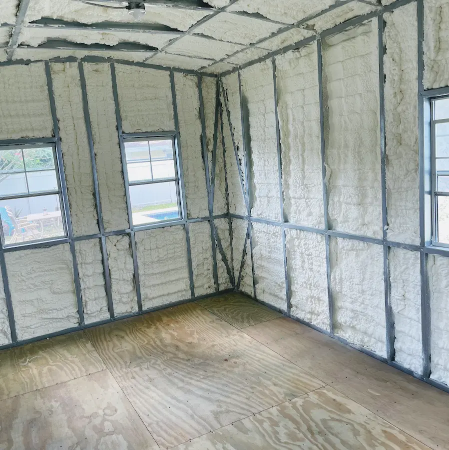 Closed-cell spray foam insulation applied to wall cavities in a residential project in Porter